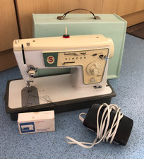Singer Stylist sewing machine with accessories