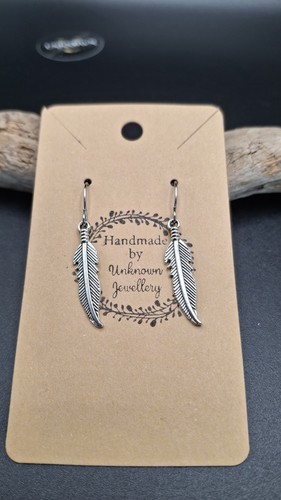 Single feather earrings