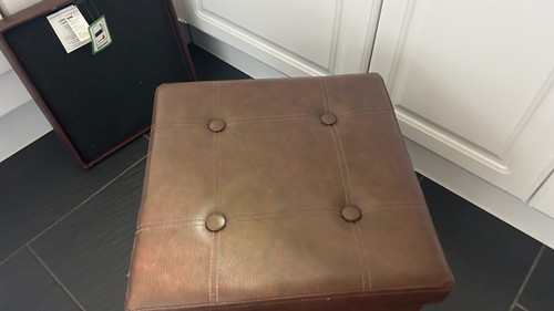 Brown faux leather pouffe