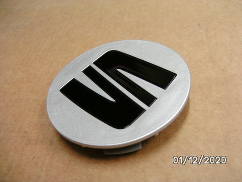 New genuine seat - badge, alloy