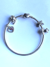PANDORA STERLING SILVER BANGLE WITH CHARMS
