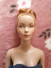 Tonner doll, with stand.