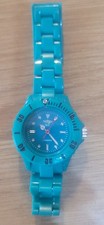 NY London turquoise plastic retro look watch. Needs new batteries.
