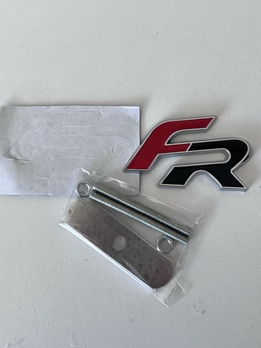 Front grille badge - front,