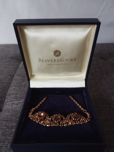 Beaverbrooks gold tone - beaverbrooks,