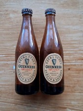 Two vintage Guinness miniature glass bottles sealed but empty