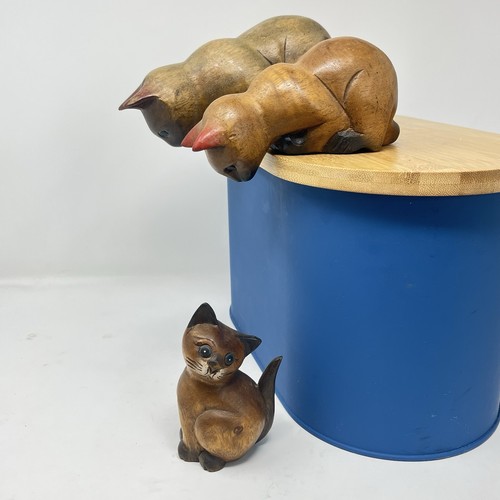 Three carved wooden cat - three,