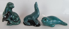 Vintage Poole Pottery Green And Black Seal, Sea Loin And Sea Otter Ornaments