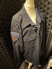 SFPD San Francisco American Genuine Vintage Police shirt with patches on arms.
