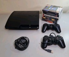 Black Play Station 3 PS3 Console With 2 Controllers And 8 Games