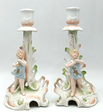 PAIR OF ANTIQUE PORCELAIN CANDLESTICKS CHILDREN. GERMAN. 7.5" TALL. DAMAGED