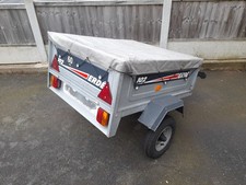 Erde 102 Trailer. tipping