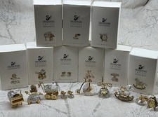 This is a collection of Swarovski Crystal Memories Classics miniature figurines