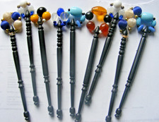 Collection of 8 black vintage lace making bobbins glass & beaded tops