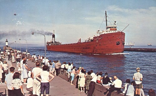 People observe giant freighter - observe,