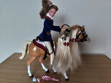 Barbie walking horse and Barbie dressed as rider