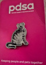 charity pin badge sitting cat