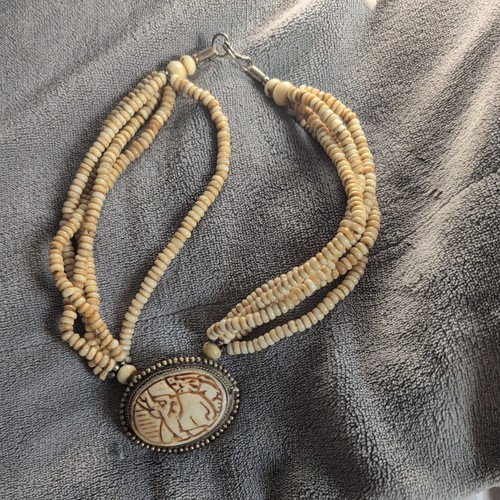 Carved bovine bone necklace - carved,