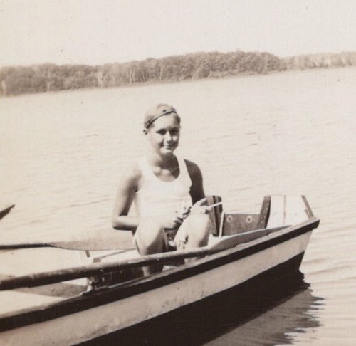 Boy sitting boat water - in,