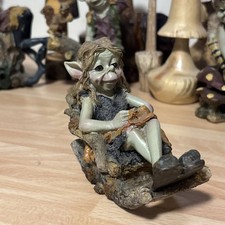 Pixie on a Rocking Chair,, By
