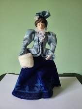 A ROYAL DOULTON? "VICTORIAN" DOLL IN A BLUE DRESS & JACKET: 9" TALL: VG COND.