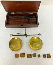 Antique boxed apothecary scales and some weights