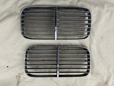 A PAIR OF JAGUAR DAIMLER BONNET SIDE GRILLES / AIR INTAKES FOR XJ6 & DS420