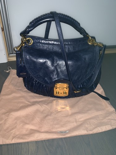 100 authentic miu - miu,