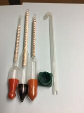 Three wine hydrometers, testing jar with instruction and glass filter tube.