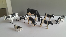 Schleich and britains black and white cows and calves
