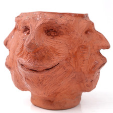 Grotesque pottery face - pottery, vase