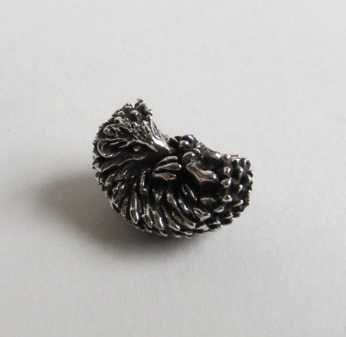 Hedgehog curled figurine