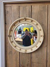 A late 19th/early 20th Century Regency style circular mirror