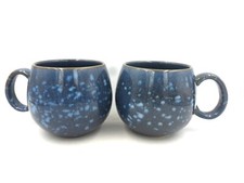 Set of 2 Reactive Glaze Sphere Cuddle Mugs in Blue and Mottled white spots.