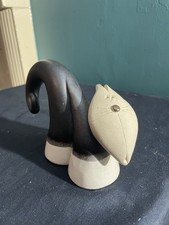 Stretching cat sculpture with