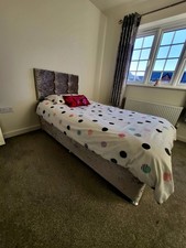 Grey single divan bed with