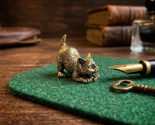 Pouncing golden brass kitten - pouncing,