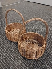 2 small brown/natural baskets