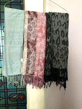 Three glittered scarves from