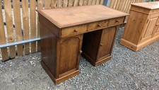 Small wooden antique 2 part pedestal desk 2 cupboards with shelf 3 drawers