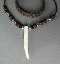 Large tooth claw shape carved