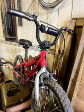 Childrens red Specialized Hotrock bike. Removable padding, used, good condition.