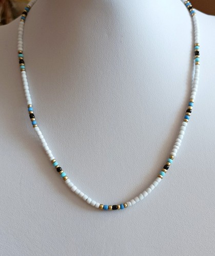 Blue and white seed bead - and,