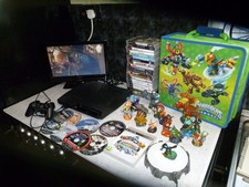 PS3 CONSOLE SLIM 300GB LOTS OF GAMES AND SKYLANDER BUNDLE ALL TESTED