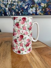 Large floral heron cross pottery jug 