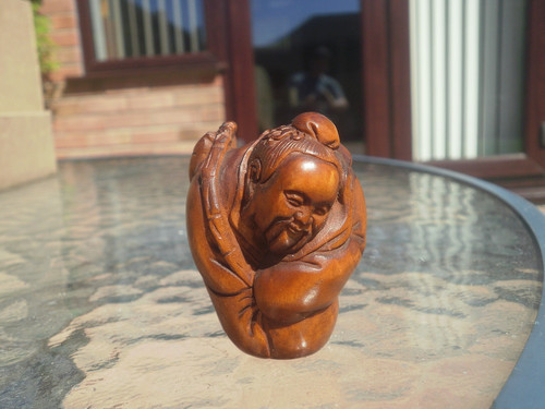 Hand carved netsuke - hand, fisherman