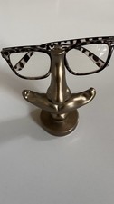 Glasses Rest In The Shape Of A Nose.  Gold Colour.  (glasses not Included)
