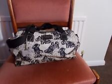 radley folkdog multiway oilskin bag with a matching Zip around Purse