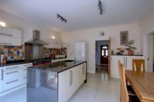 Kitchen with black granite worktop, vinyl wrapped doors and dishwasher