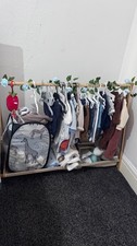wooden baby wardrobe  rail with a fabric shelve . 